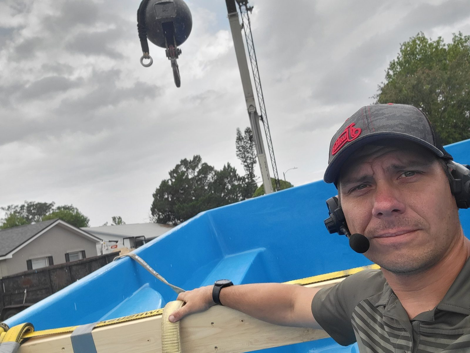 Joshua Lowe of Southern Construction rigging a fiberglass pool shell for a crane
