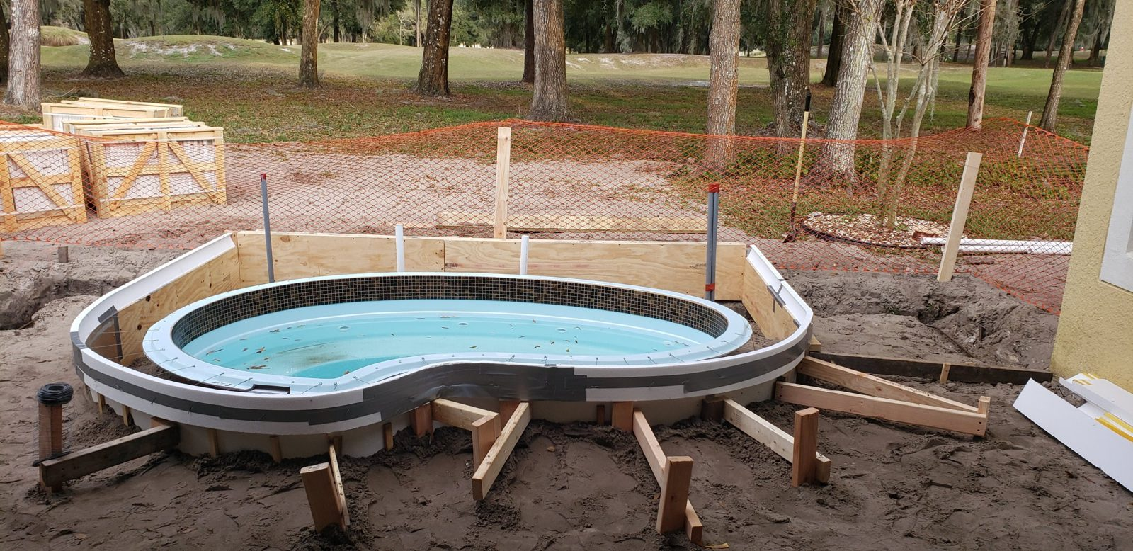 Plywood and foam forms around a raised fiberglass spa