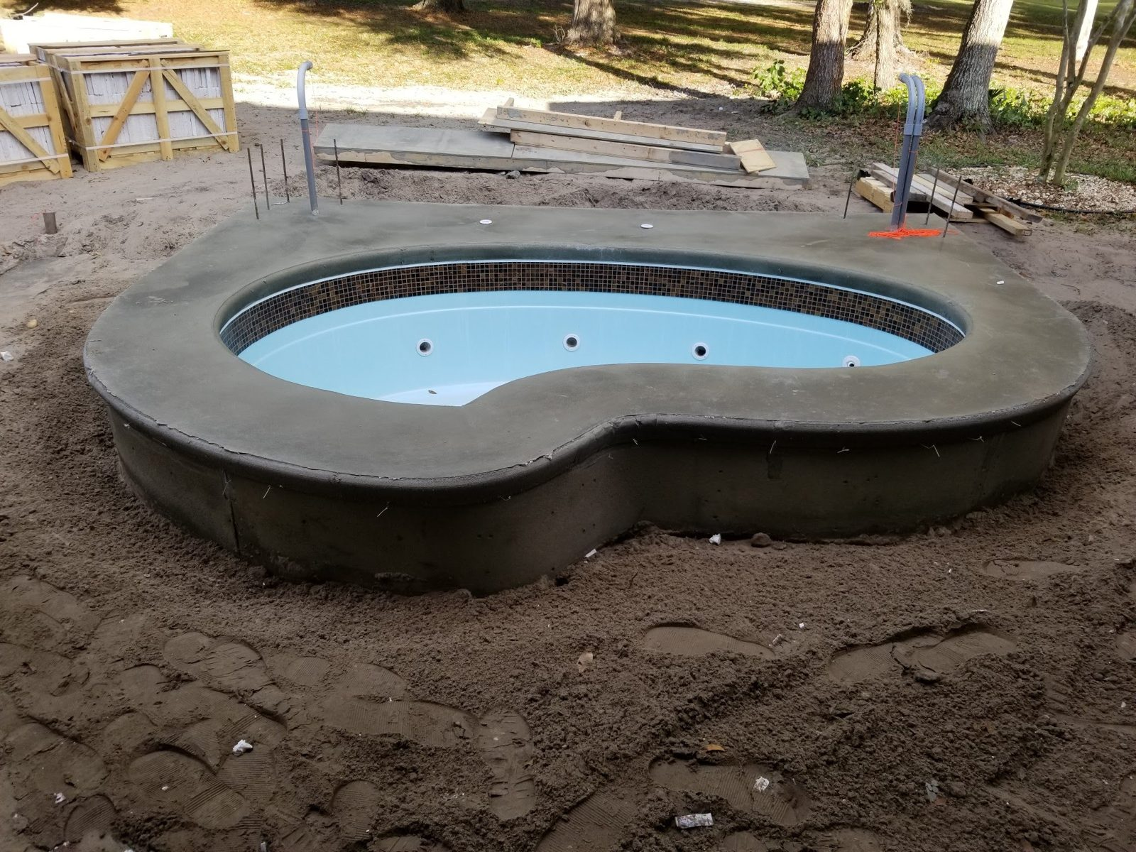 Raised concrete spa wall after forms were removed