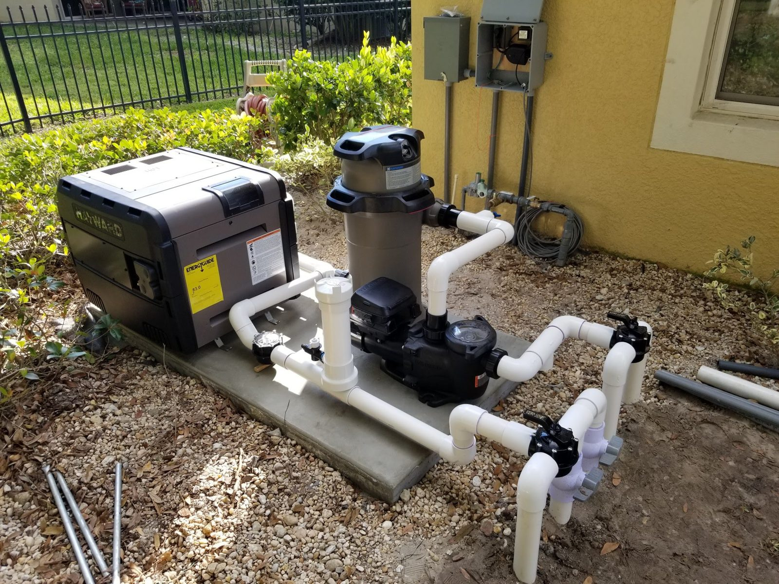 Hayward spa heater, filter and variable-speed pump on a concrete pad