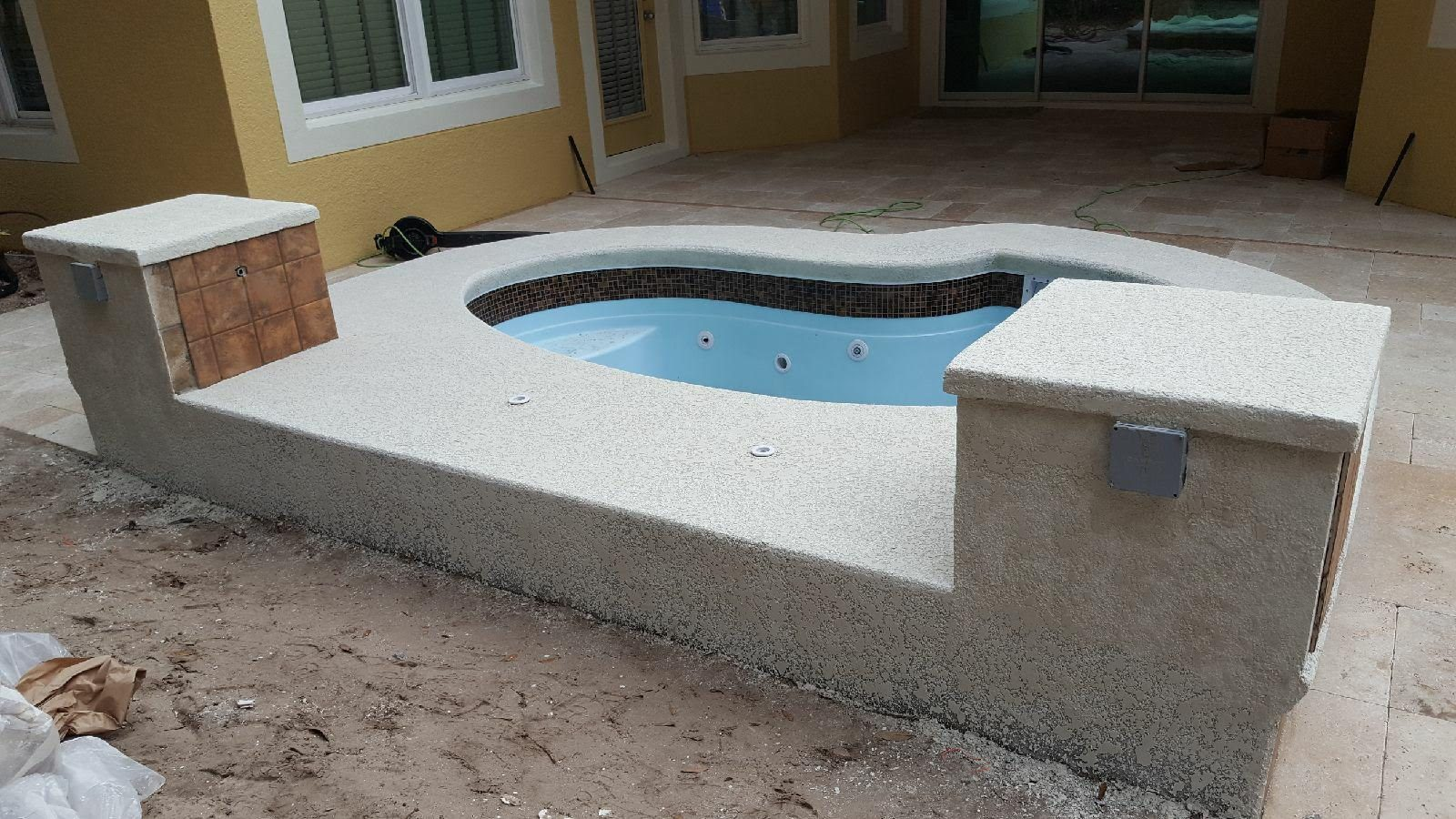 Back side of a raised spa wall with pillars
