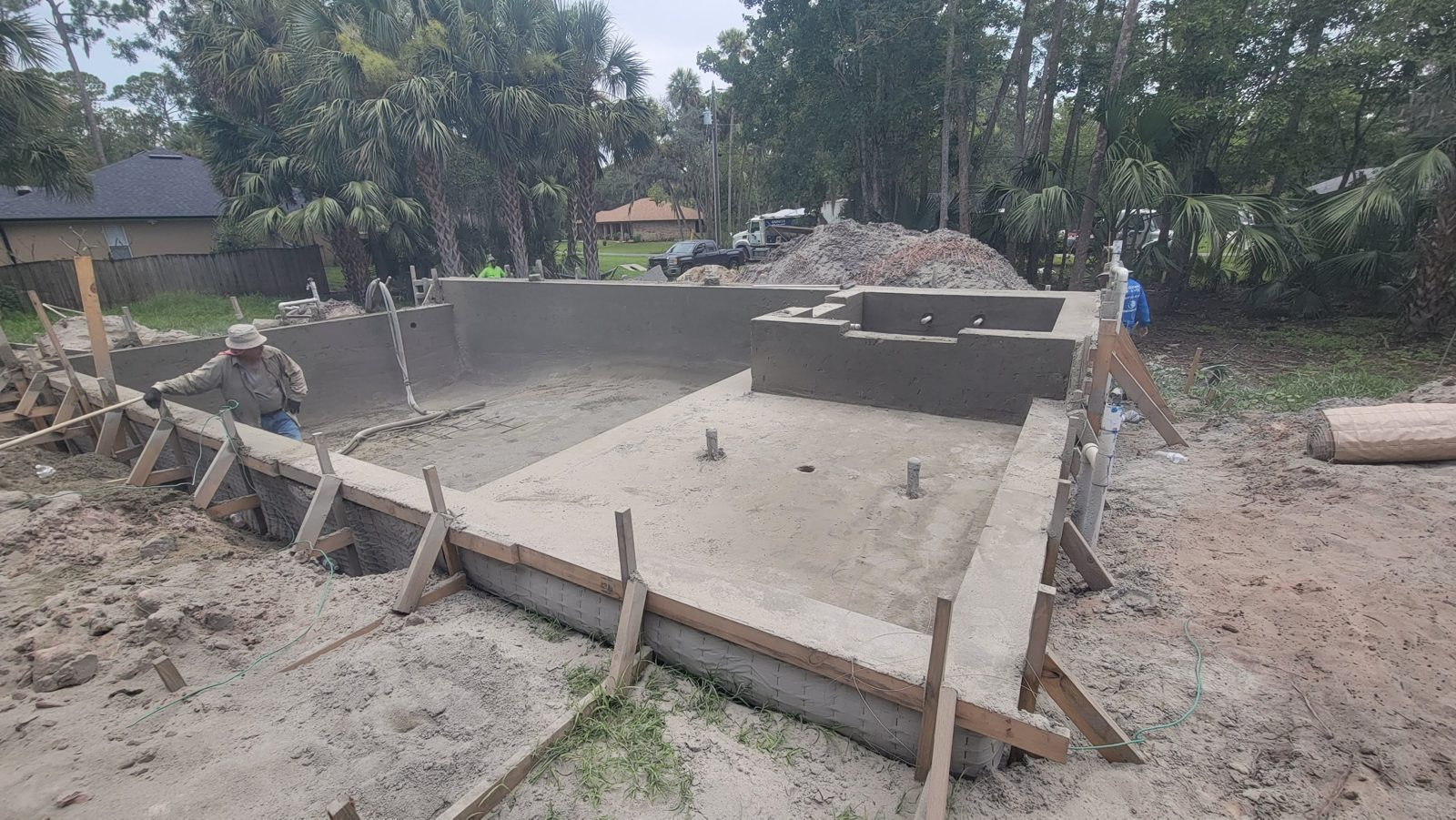 Gunite pool shell with tanning ledge, steps and raised spa