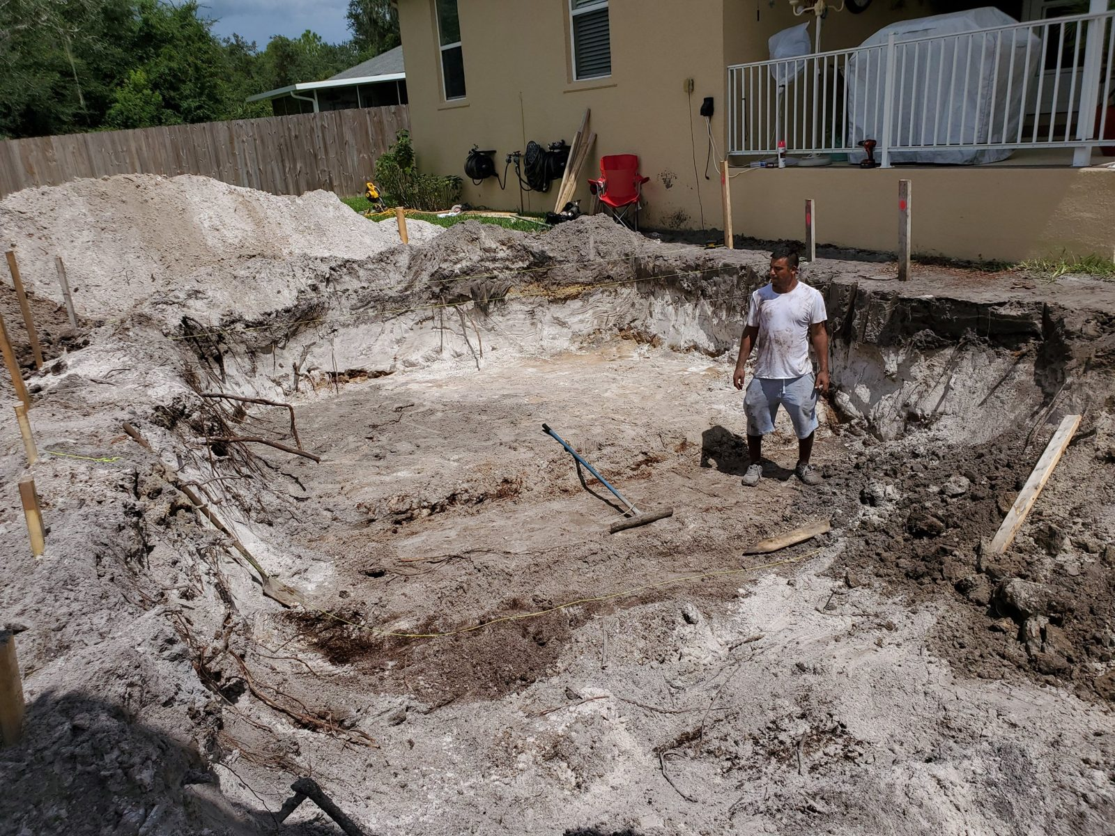Cleared pool excavation behind a Deltona home
