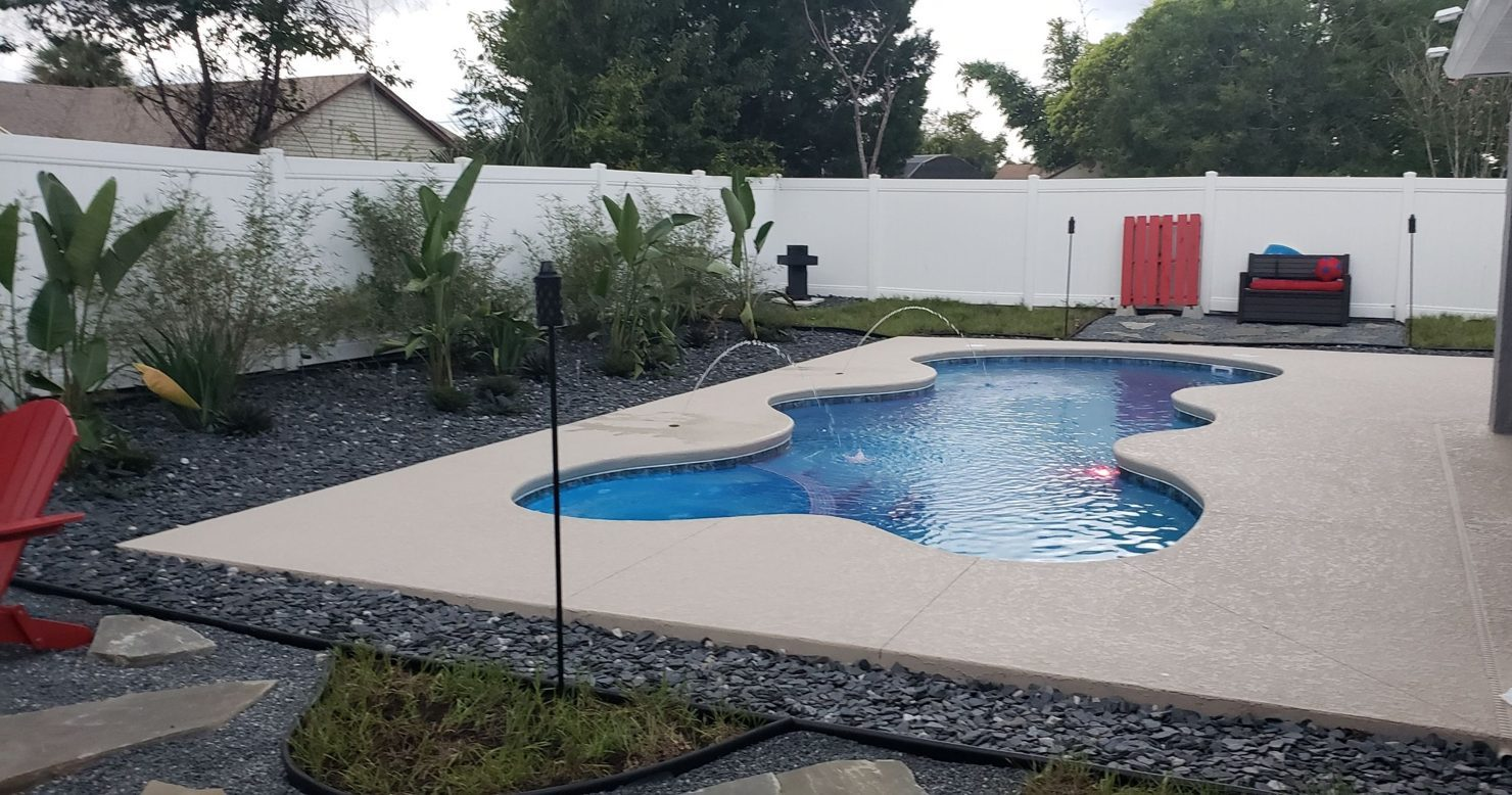 Fiberglass pool with deck jets and new landscaping in Deltona, Florida